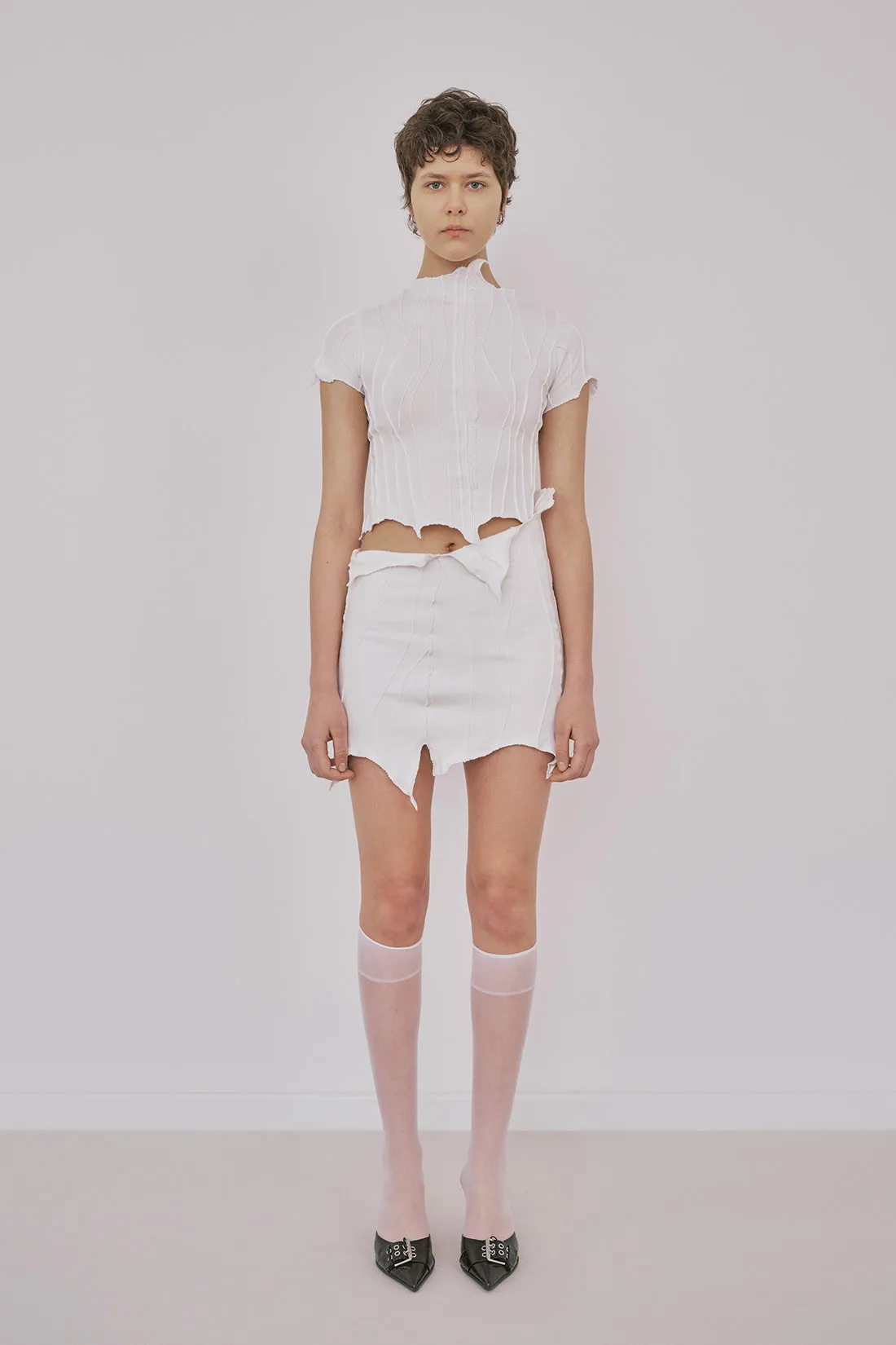 Suture Tee